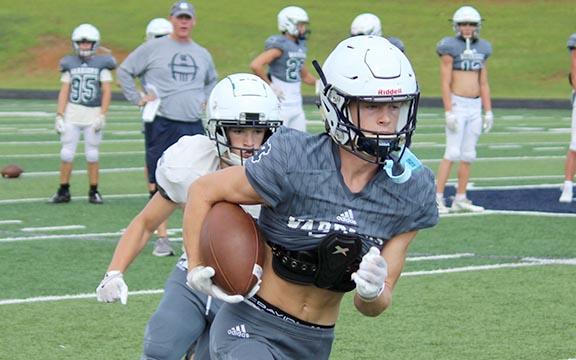Gaines Clark heads down the field after catching a pass in a recent practice. (Photo/Mark Turner)