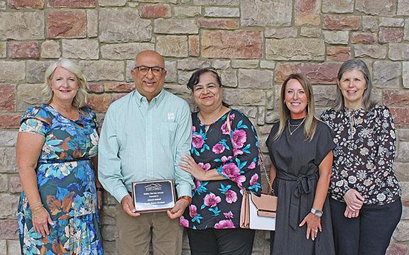 Ahmed Amirali of Dunkin’ Donuts Cleveland accepts his Stellar Service Award from Beth Truelove, Dr. Shanda Ginn and Kelly Wilkins. (Photo/Eric Tiongson)