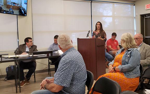 Andrea Evans shares her concerns about the added the traffic on West Jarrard Street as developer Tom Williams listens. (Photo/Samantha Sinclair)