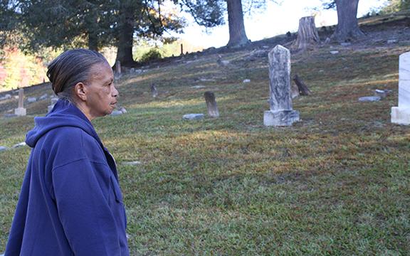 Andy Allen takes it all in, admiring the restored graves in Bean Creek Cemetery. (Photo/Eric Tiongson)