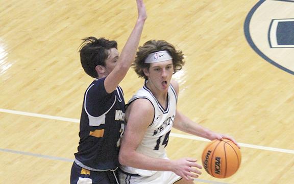 Blayne Gunter drives past a Horizon defender during Tuesday's game in Cleveland. (Photo/Mark Turner)