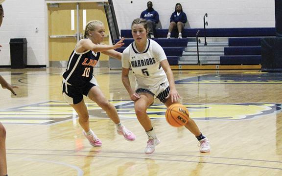 Emma Lightsey, shown during the holiday tournment at Truett McConnell last weekend, set a school record with 10 3-pointers during the win over Cherokee Bluff Tuesday night in Cleveland.  (Photo/Mark Turner)