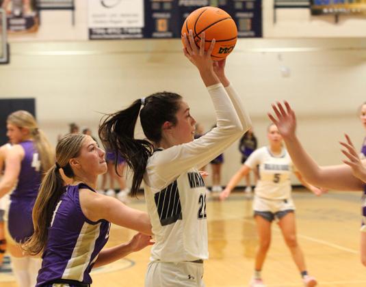 Kylie Watkins drives past Lumpkin County's Maddie Lee during the region game last Thursday in Cleveland