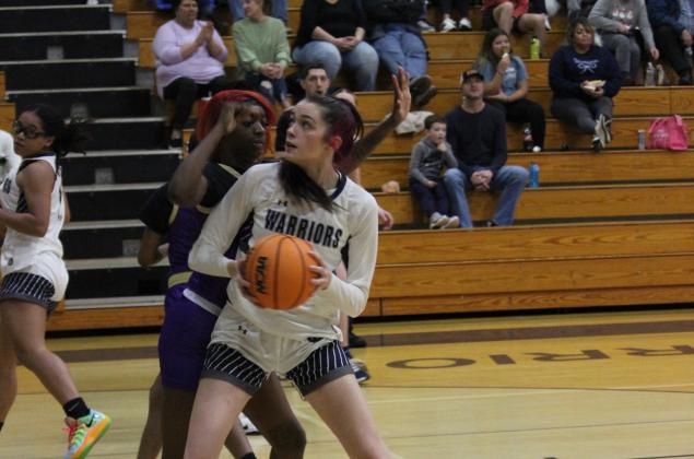 Kylie Watkins works against a Bainbridge defender during the state state playoff game. (Photo/Mark Turner)