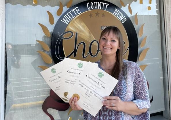 Marketing Specialist Erin Etris won three awards, including two for first place. (Photo/Jerry Grillo)