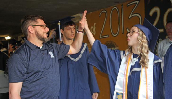WCHS Assistant Principal Adam Wiley greeted every student with hugs, high-fives, and handshakes. (Photo/Denise Etheridge)