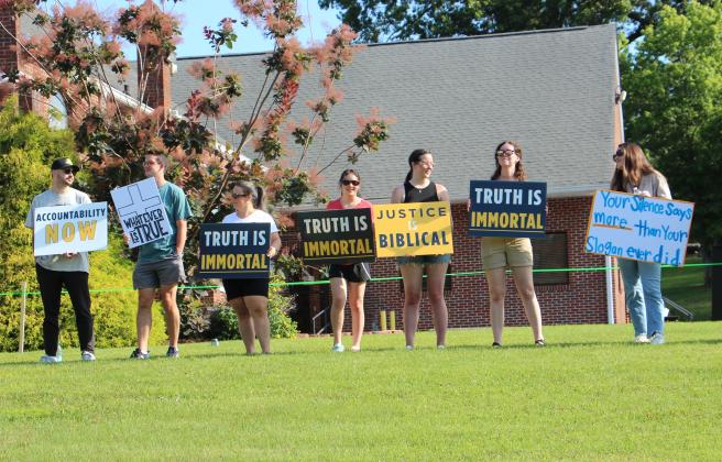 Protesters demand an investigation into allegations of sexual abuse and harassment at Truett-McConnell University, and insist that anyone involved in covering up the alleged abuse be held accountable. (Photo/Denise Etheridge)