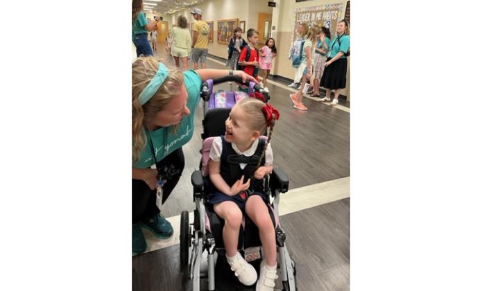 Carter Bresnahan is happy to see her teacher, Sarah Carter, at Mount Yonah. JANE GRILLO/SPECIAL