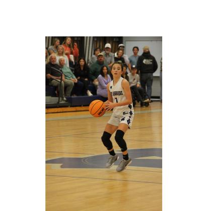 Bentley Allison makes a pass during the seventh grade game last Tuesday. MARK TURNER/WCN