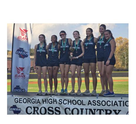 The WCHS girl's team shows off some hardware following their fourth place finish in the Class AAA meet Saturday in Carrollton. Shown are, from left, Alexis Kelley, Angela Lozada, Julie Black, Carly Black, Darla Wright, Maddie Evans and Emma Windham. MARK TURNER/WCN