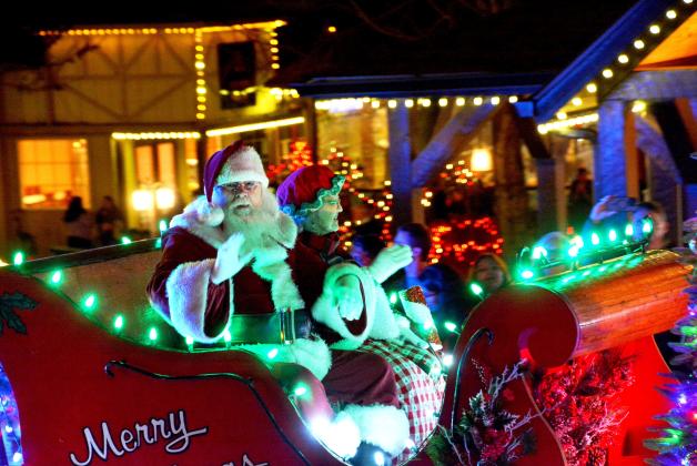 Santa and Mrs. Claus wave to the crowd during the 2025 Helen Christmas Parade.