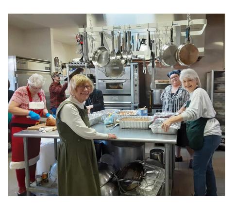 Volunteers cook a free Christmas Dinner in a past year.