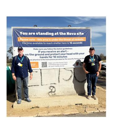 Pastor David Sansot, left, and Pastor Avery Hutto of The Bridge Church in Cleveland stand at the Nova site in southern Israel, where Hamas operatives attacked on Oct. 7, 2023. See more Summit photos on page 6A. SUBMITTED PHOTO