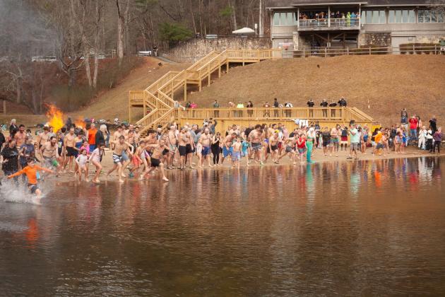 Hundreds of people rush into the water for the Winter Bear Plunge at Unicoi State Park on Jan. 3. PHOTO COURTESY OF JESSI TAYLOR/UNICOI STATE PARK