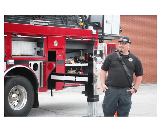 Lt. Jason Reed of the Helen Fire Department explains the ins and outs of the department’s new fire truck to students at Mountain Education’s White Campus. CARLY HENDERSON/WCN