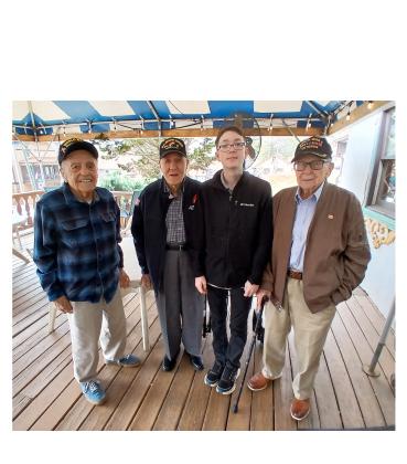 From left, Andy Negra, Hilbert “Hibby” Margol, Caleb Schneider and Alan Kinder gather following lunch. Schneider, 14, raises money for his Lunch with Veterans program through donations through his radio station, G.I. Jive Radio. SUBMITTED PHOTO