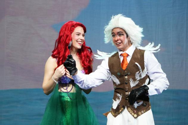 Ariel, left, played by Sarah Wilkinson is delighted with the fork found by Scuttle the seagull, played by Edwin Polangco-Kenney. SUBMITTED PHOTO