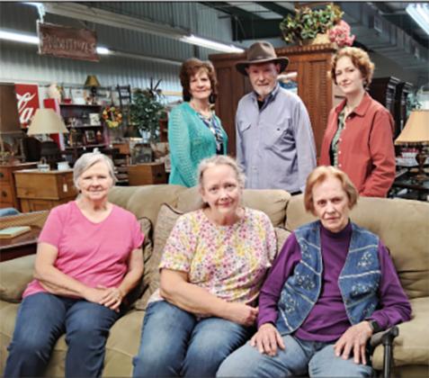 The owner, managers and staff at Mountain Laurel Antique Mall and Furniture Consignment Showroom enjoy greeting customers. Sitting from left: Katie White, Barbara McClure and Dorothy Ralston. Standing from left: Carol Burgess, Bobby Dyer and Ariana McClure. Not pictured: Larry Hall, Lois Boggs and Ed Hawksford. DENISE ETHERIDGE/WCN