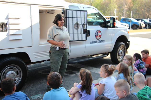 Astrid DeWeaver of White County Animal Control answers questions from students during Career Day at Mossy Creek Elementary School on April 2.
