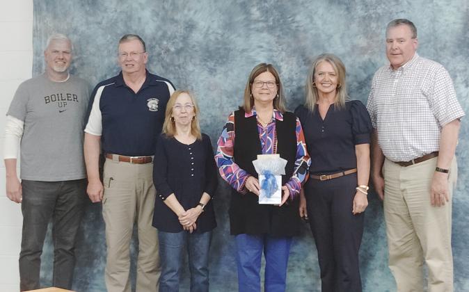 The White County Board of Education thanked former Superintendent Laurie Burkett for her years of service to the school system on March 26. From left: School Board Members Jon Estes, Charlie Thomas and Linda Erbele, Burkett, School Board Chair Missy Jarrard and School Board Member John Solmon. DENISE ETHERIDGE/ WCN