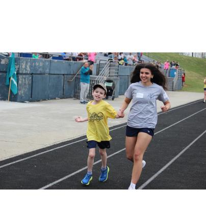 Cooper Peacock and buddy Shiloh Piovano sprint down the track during a race.