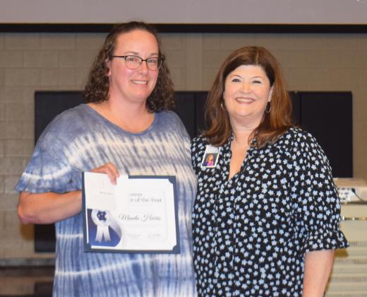 Mandie Harris, left, was given the school system's Bus Driver of the Year award. At right is Human Resources Director Laura Corley.