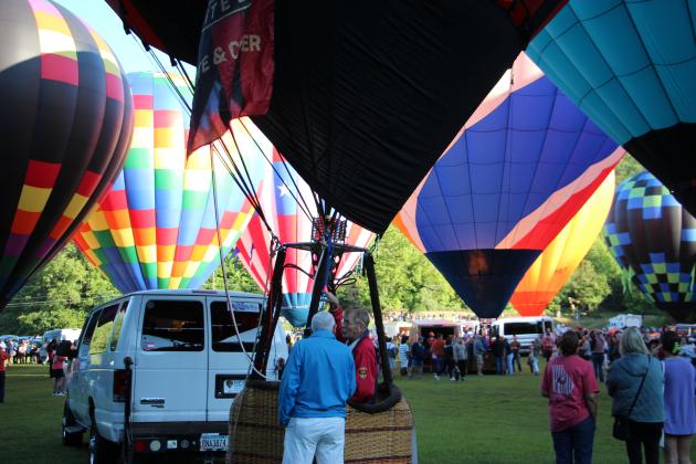 Spectators and balloon crews gather in Helen for the 53rd annual Helen to the Atlantic Balloon Race &amp; Festival on June 4. Around 20 balloons are participating in events throughout the weekend. CARLY HENDERSON/WCN