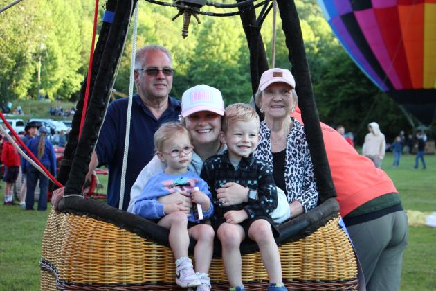 A family takes a lift in a hot air balloon at the 53rd annual Helen to the Atlantic Balloon Race &amp; Festival. CARLY HENDERSON/WCN
