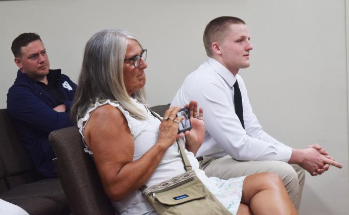 White County High School broadcasting instructor Robert Lundy, far left, and Janis Mangum, center, attend a signing ceremony for Bryson Howe, far right, who received a congressional appointment to the U.S. Naval Academy in Annapolis, Maryland. PHOTOS BY DENISE ETHERIDGE/WCN