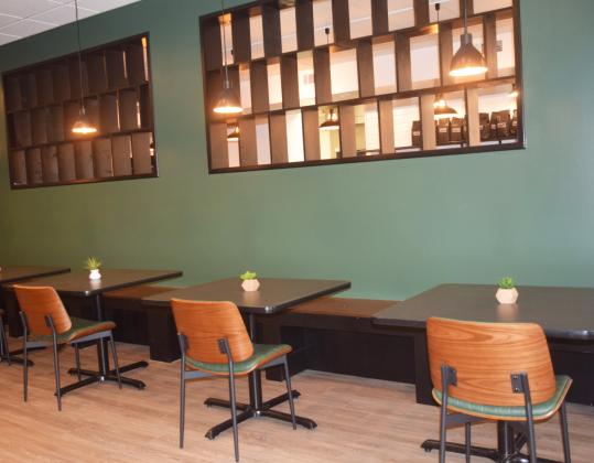 Customers can sit a while in the new Farmhouse Coffee space on the square.