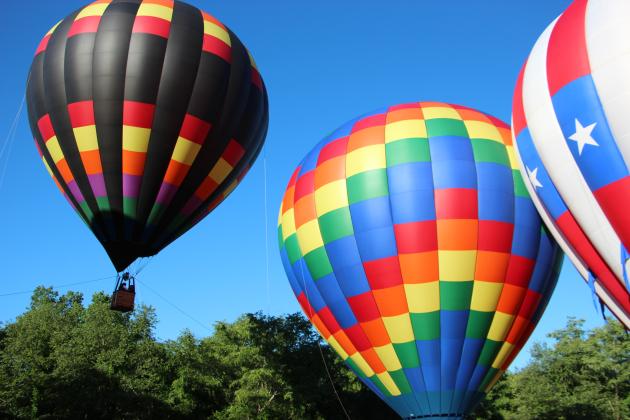 Spectators and balloon crews gather in Helen for the 53rd annual Helen to the Atlantic Balloon Race &amp; Festival on June 4. Around 20 balloons are participating in events throughout the weekend. CARLY HENDERSON/WCN