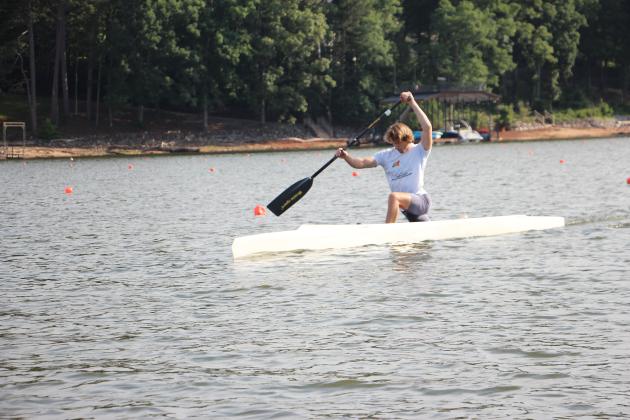 Edward Surles, 24, a Team USA athlete, paddles in a high-kneel canoe at Lanier Canoe &amp; Kayak Club. CARLY HENDERSON/WCN