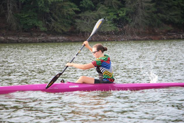 Brynn Collins, 18, a Team USA athlete, paddles a pink boat during practice. She will compete in a women’s K-4 event at an upcoming world competition in Europe. CARLY HENDERSON/WCN