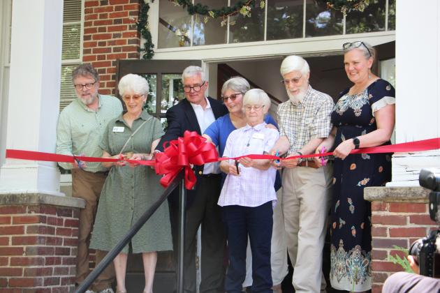 Members of the Sautee Nacoochee Center staff and board members cut the ribbon on June 6, officially re-opening the Sautee Nacoochee History Museum. CARLY HENDERSON/WCN