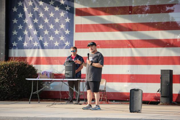 Run for Freedom 5K Committee Chair Carlos Santiago addresses runners before race time last Saturday.