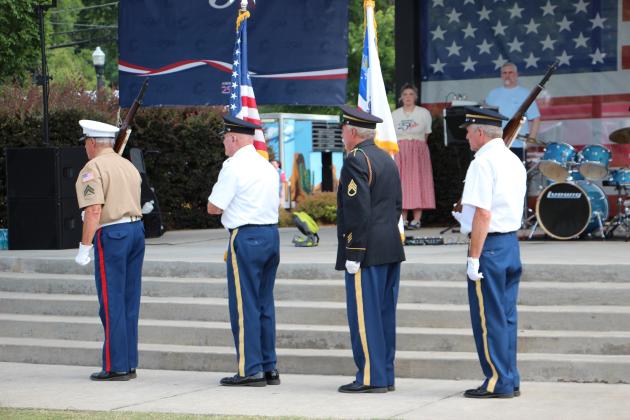The White County Honor Guard presents the flag in Freedom Park early on July 4th.