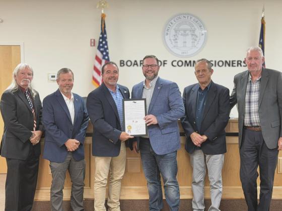 On  Monday, the White County Commission presented Truett-McConnell University President Larry Lyon a proclamation honoring the school's 80th anniversary. From left: Commissioners Craig Bryant and Shan Ash, Chairman Traivs Turner, Lyon, and Commissioners Lyn Holcomb and Ed Nix. PHOTO BY BRYCE BARRETT