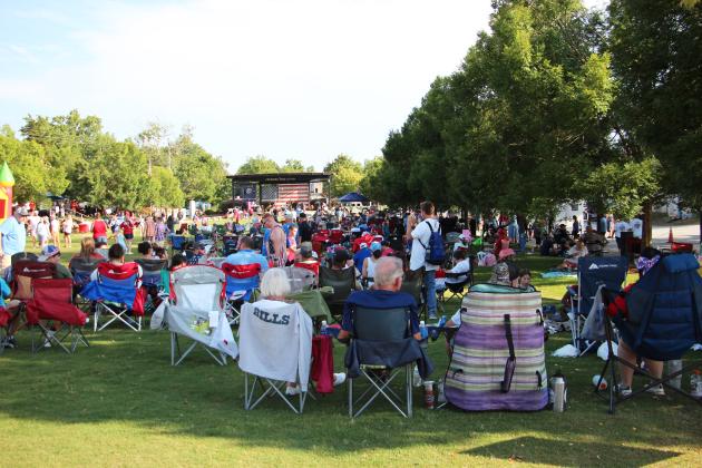 Hundreds of people relax in Freedom Park for the July 4th celebration last Saturday.