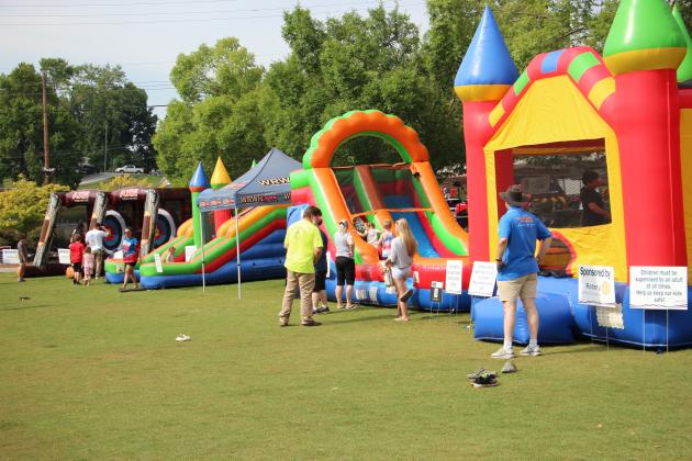 Children flock to the bounce houses in Freedom Park during the Cleveland-White 250 celebration last Saturday.
