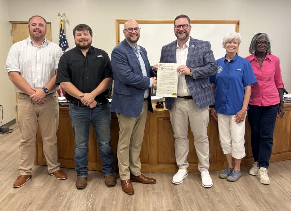 Members of the Cleveland City Council present a proclamation recognizing the 80th anniversary of Truett McConnell University to TMU President Dr. Larry Lyon during the council's July 20 meeting. The proclamation honored the university's eight decades of service to the community. CARLY HENDERSON/WCN