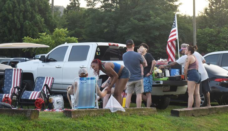 Crowds of people descended on the City of Helen to celebrate the nation's 250th Independence Day. People spread out in the city's parks on picnic blankets, tail gated in parking lots or relaxed by the Chattahoochee River. The city set off fireworks after dark from Wilkins' Field. DENISE ETHERIDGE/WCN