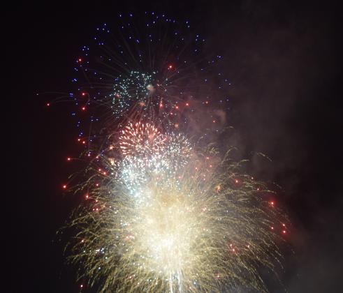 Crowds of people descended on the City of Helen to celebrate the nation's 250th Independence Day. People spread out in the city's parks on picnic blankets, tail gated in parking lots or relaxed by the Chattahoochee River. The city set off fireworks after dark from Wilkins' Field. DENISE ETHERIDGE/WCN