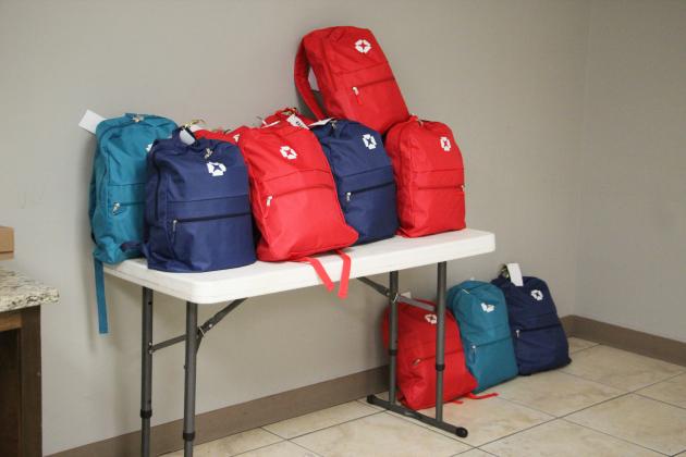 Backpacks assembled during the Love Your Neighbor event at Helen First Baptist Church will be distributed to children entering foster care. The backpacks include handmade blankets, hygiene items, coloring books, crayons and handwritten encouragement cards.