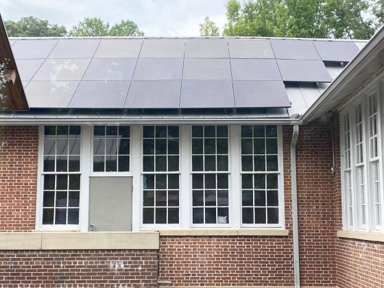 Thirty roof-mounted solar panels were installed at the Sautee Nacoochee Center as part of a new solar energy system that also includes a 40-panel ground array. The installation is expected to save the center nearly $500,000 in energy costs over the panels’ 30-year lifespan. SUBMITTED PHOTO