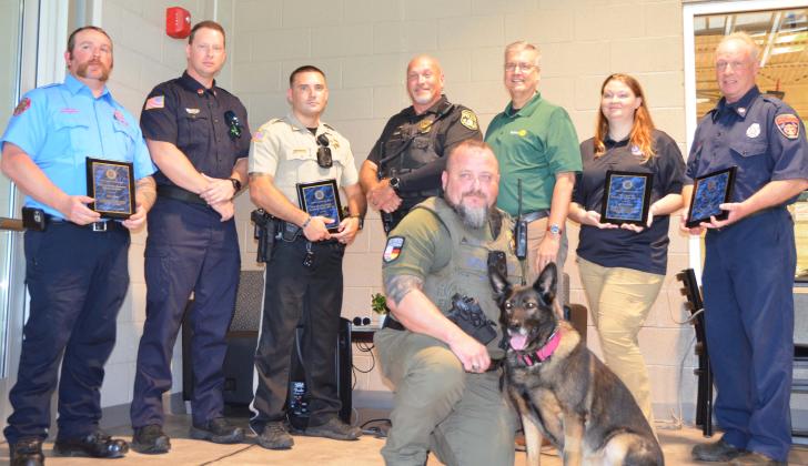 The White County Rotary Club presented awards to First Responders on Saturday, July 18. Kneeling in front is Helen Police Sgt. W. C. Barrett, handler for K-9 Zora. Standing, from left, are Cleveland Firefighter Will LaPree, Helen Fire Department Firefighter Hudson Anderson; White County Sheriff’s Deputy Michael Vice, Cleveland Police Officer David Bruce, Rotary President Phil Dodson, White County 911 Communications Officer Liberty Garrett, White County Firefighter Steve Hopper. See more photos on page 7A. L