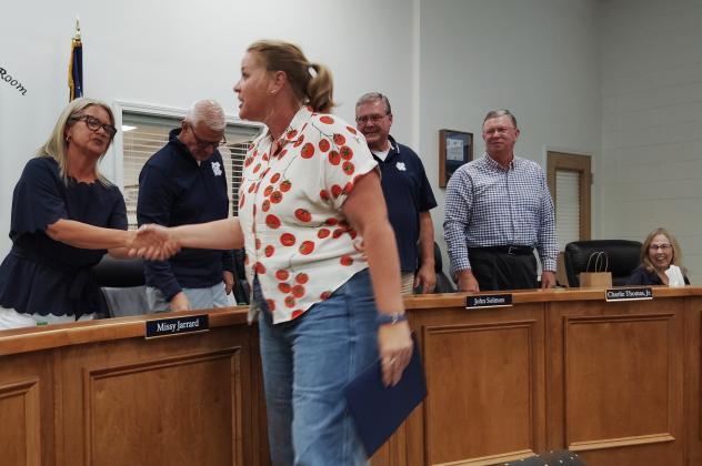 White County Middle School Agriculture teacher Meg Dickerson is congratulated by the White County Board of Education during a July 30 meeting. DENISE ETHERIDGE/WCN