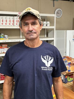 White County Food Pantry Director Mike Butcher oversees the nonprofit's operations. He drives the food pantry van, unloads goods, arranges for additional volunteers and schedules facility maintenance.