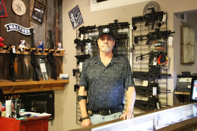Gun Commanders owner Mike Carter stands inside the Cleveland store. Carter said he hopes to shift the focus back to the business and its purpose-built firearms following controversy surrounding the Flock camera. CARLY HENDERSON/WCN