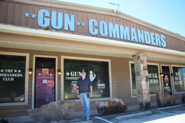 Gun Commanders owner Mike Carter stands outside the Cleveland store. Carter purchased a private Flock camera as an additional security measure for the business. The camera remains mounted outside the store but has been covered following public backlash over its presence. CARLY HENDERSON/WCN