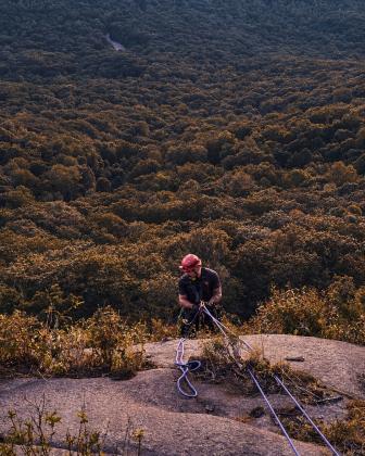 White County firefighter Will Roper rappels down the west face of Mount Yonah to reach a stranded climber Aug. 25. Roper secured the climber and assisted them to safety. SUBMITTED PHOTO